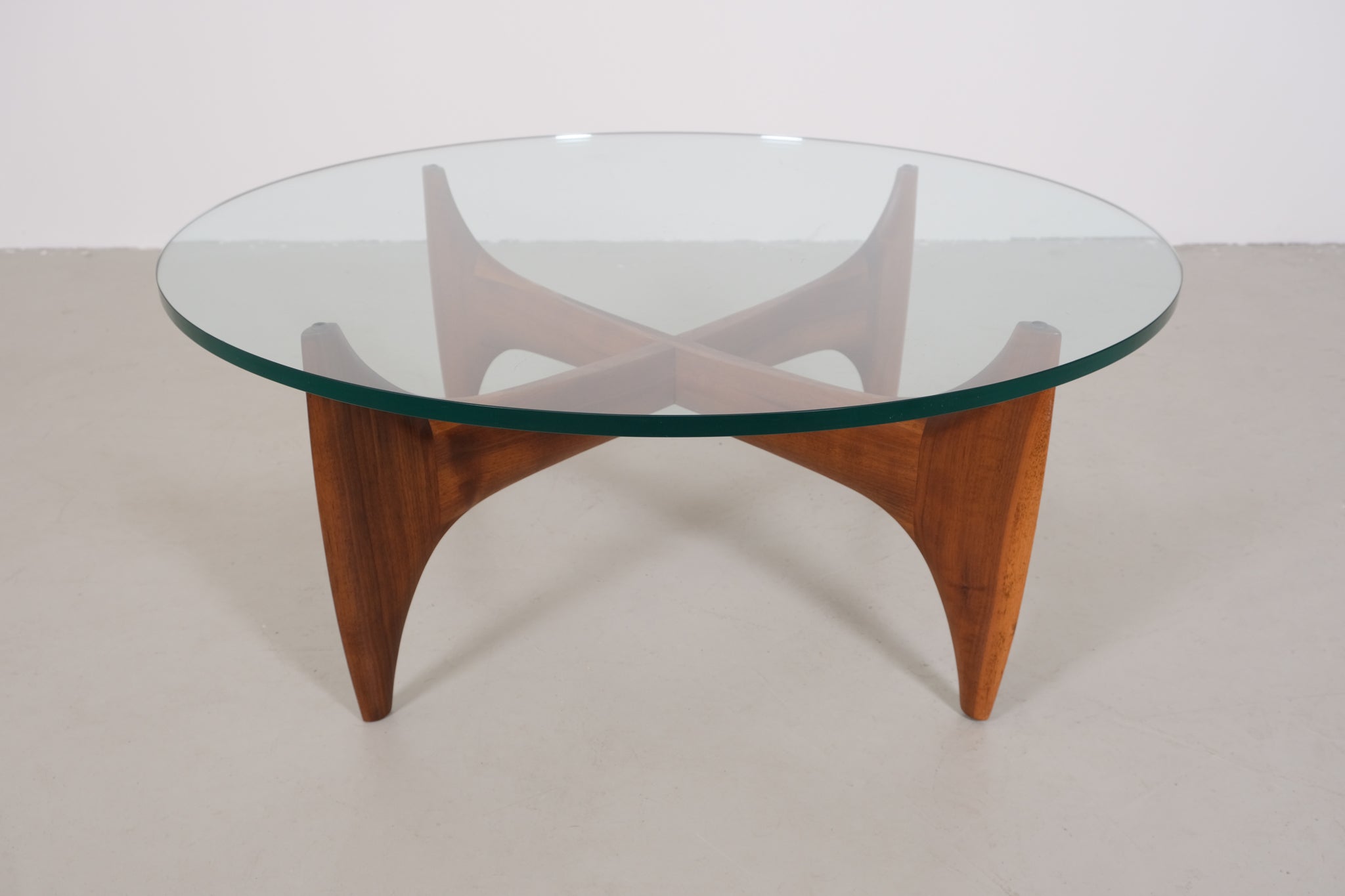 Vintage mid-century coffee table with teak base and glass top