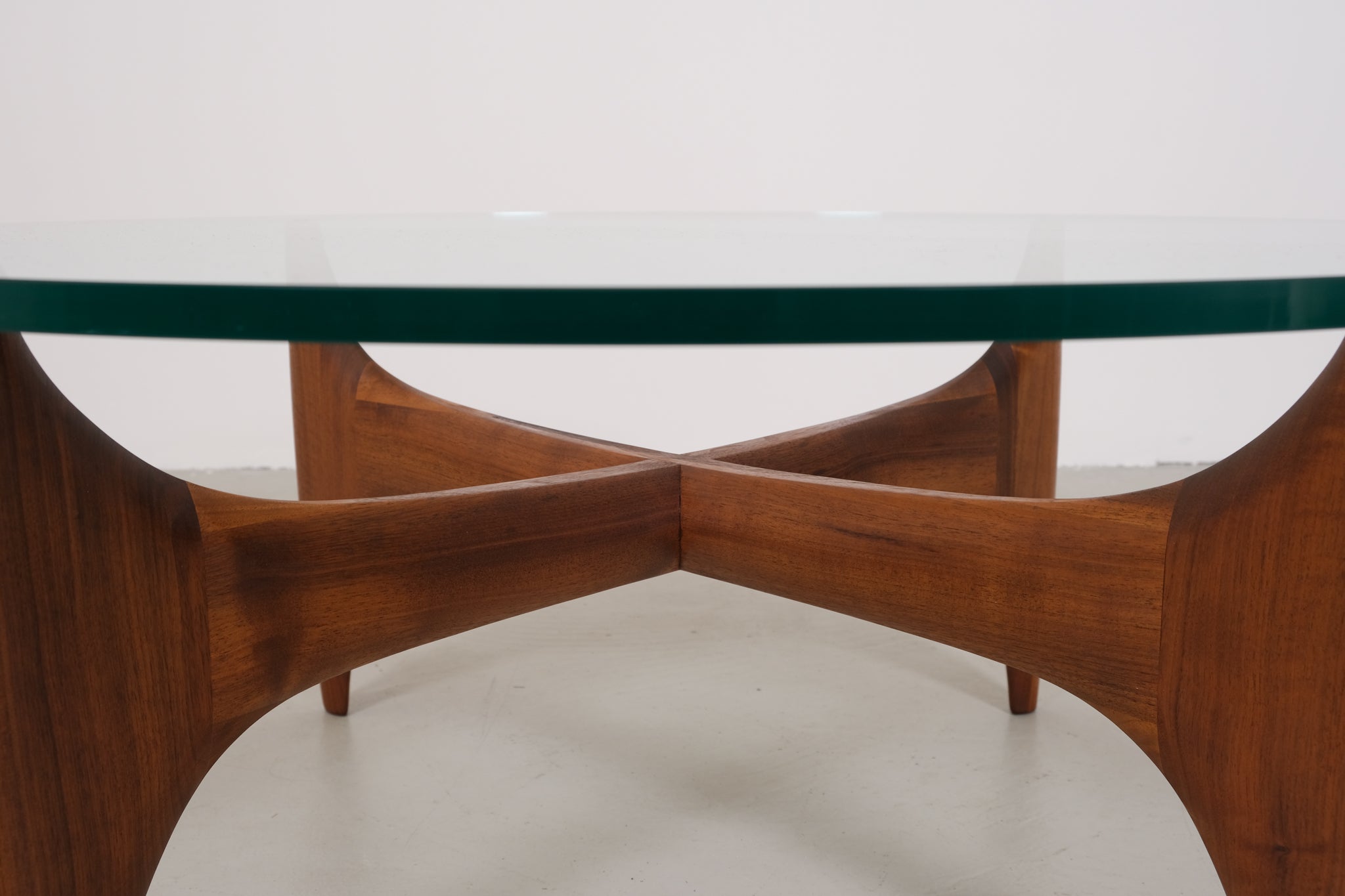 Vintage mid-century coffee table with teak base and glass top
