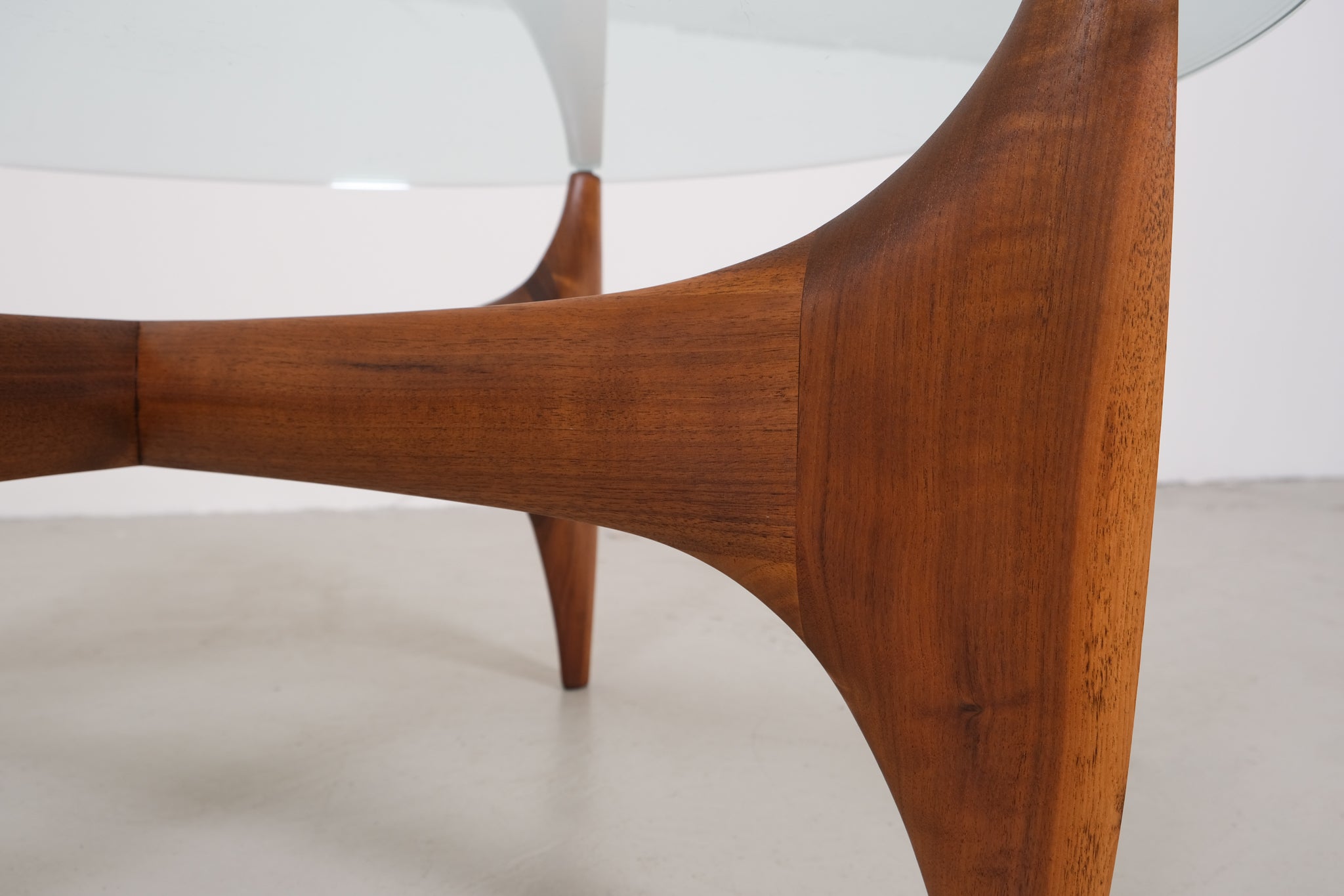 Vintage mid-century coffee table with teak base and glass top