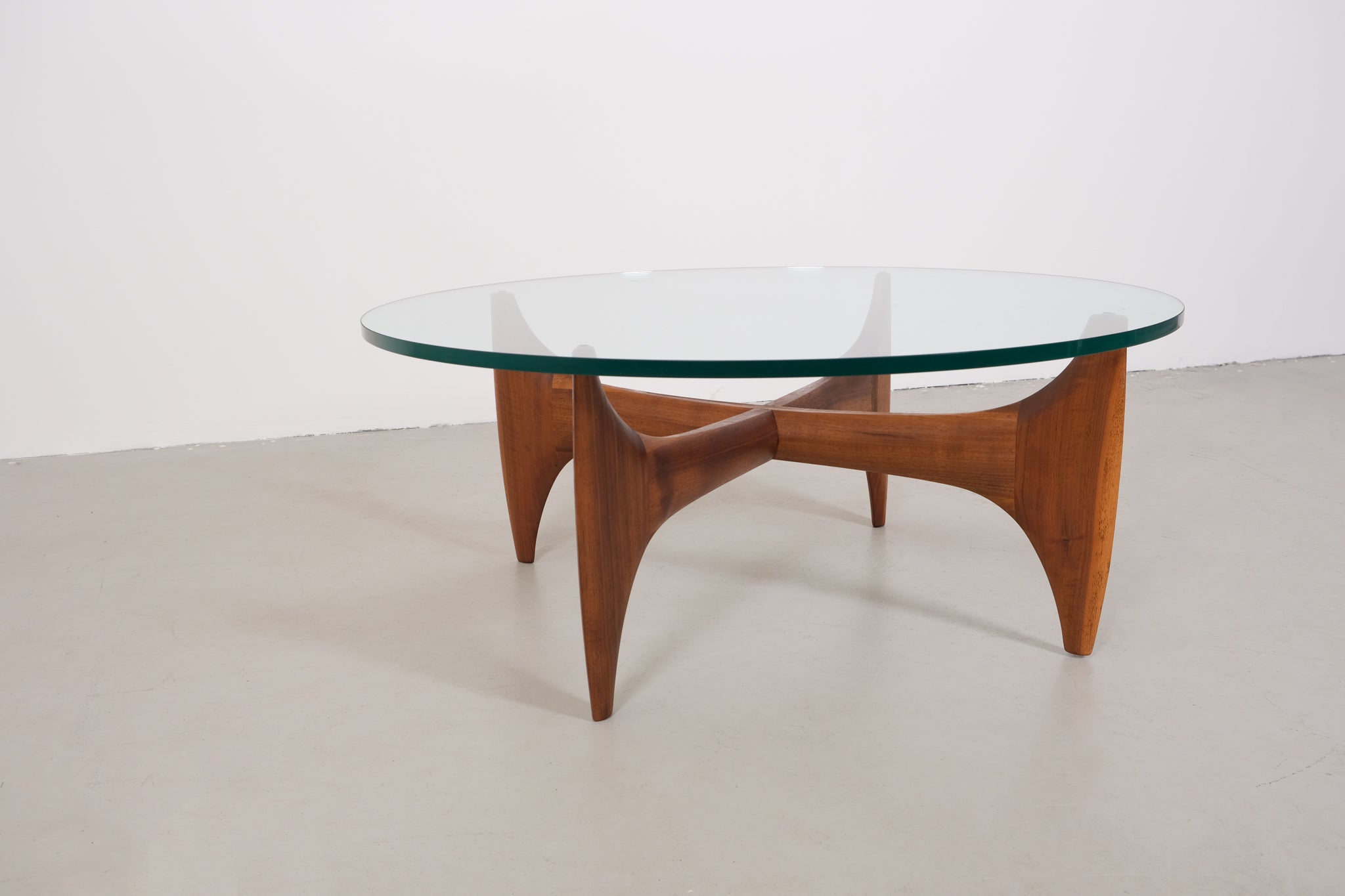 Vintage mid-century coffee table with teak base and glass top
