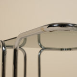 Close-up of a metallic table with a beige background