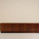 Wooden sideboard against a beige background