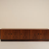 Wooden sideboard against a beige background