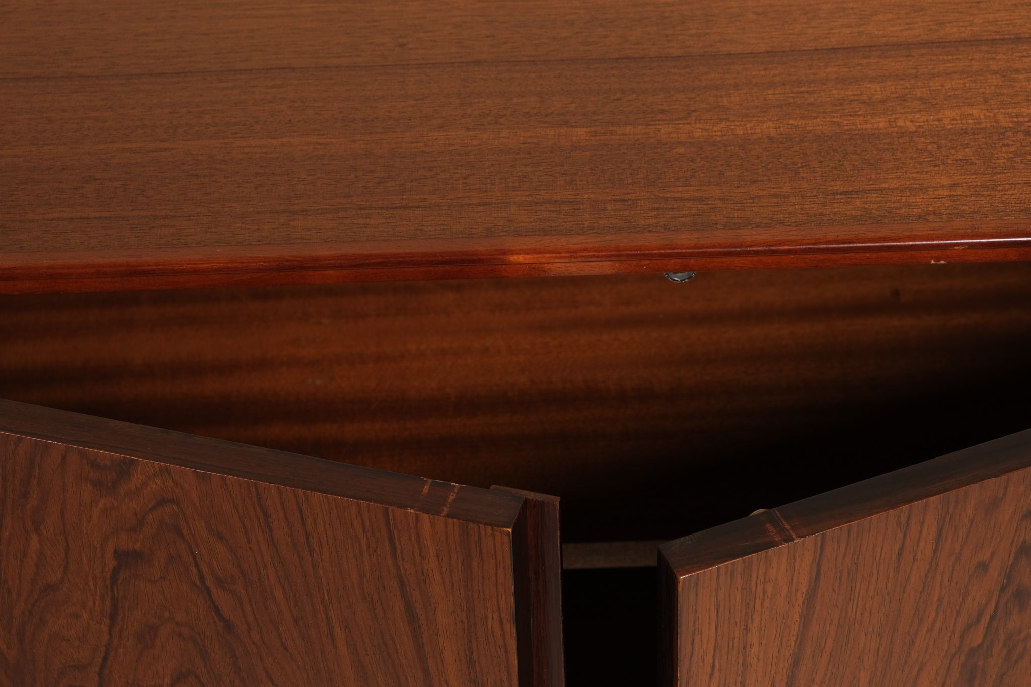 Close-up of a wooden surface with a visible scratch