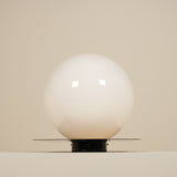Glossy white sphere on a beige background