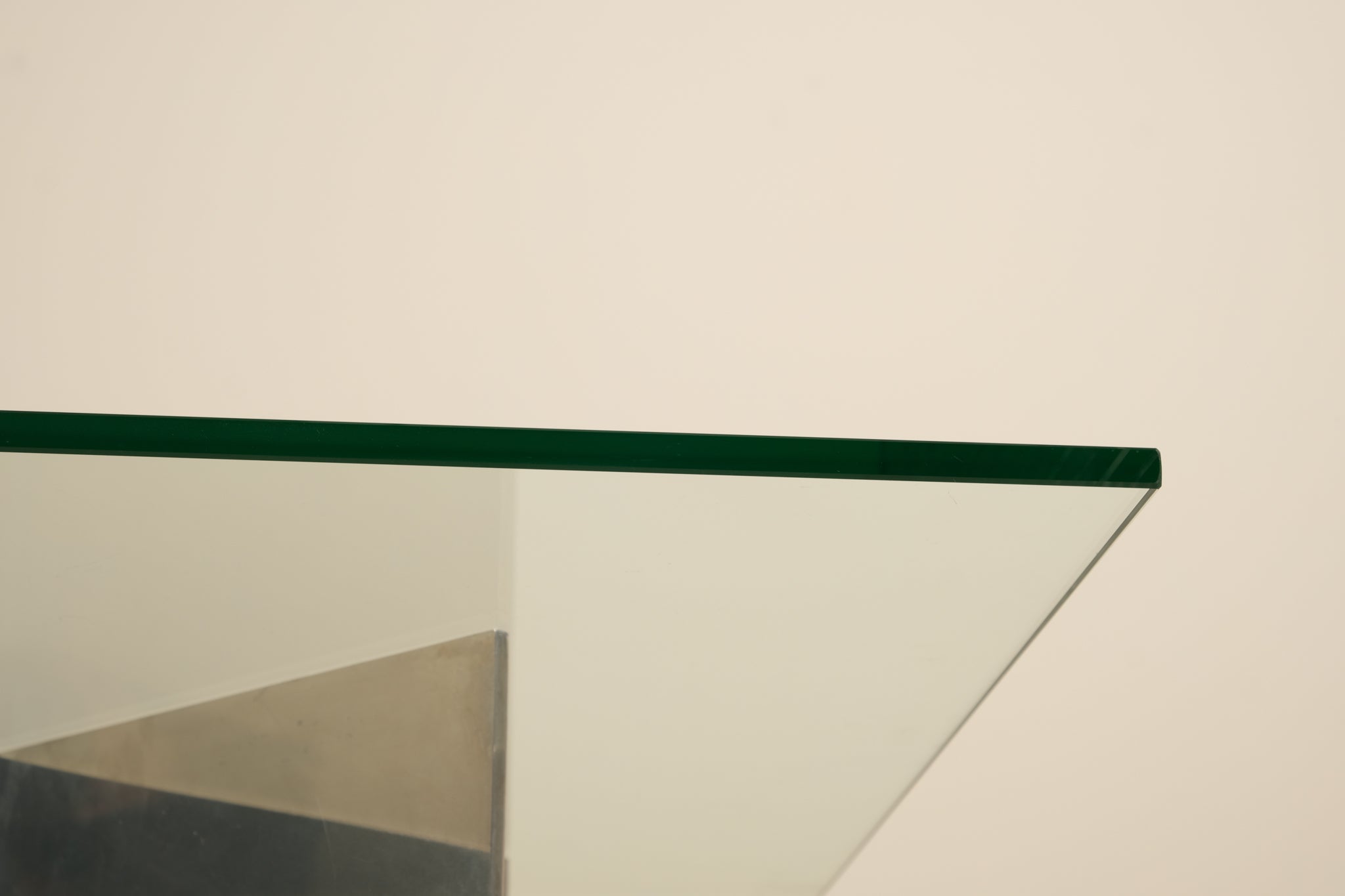 Glass table top on a beige background