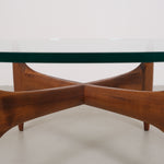 Vintage mid-century coffee table with teak base and glass top