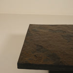 Dark stone coffee table on a plain background