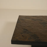 Dark stone coffee table on a plain background