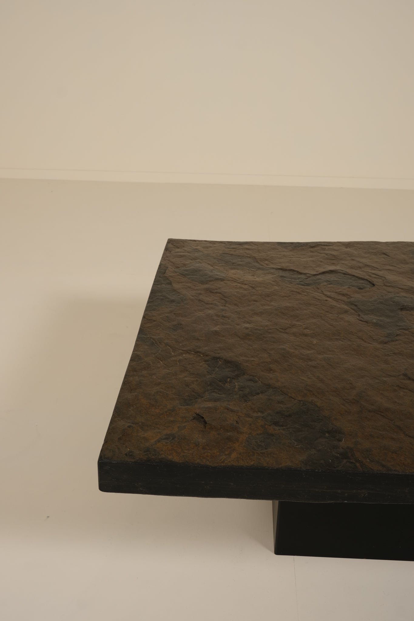 Dark stone coffee table on a plain background