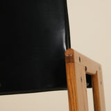 Black screen or panel with wooden frame on a beige background