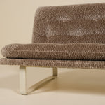 Brown textured sofa on a beige background