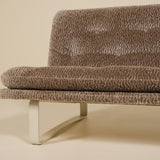 Brown textured sofa on a beige background