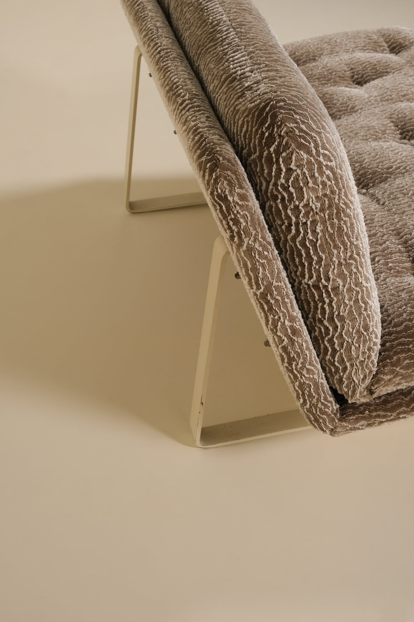 Brown textured artifort sofa on a beige background