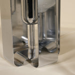 Metallic silver lamp on a beige background