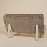 Back of an artifort sofa on a beige background