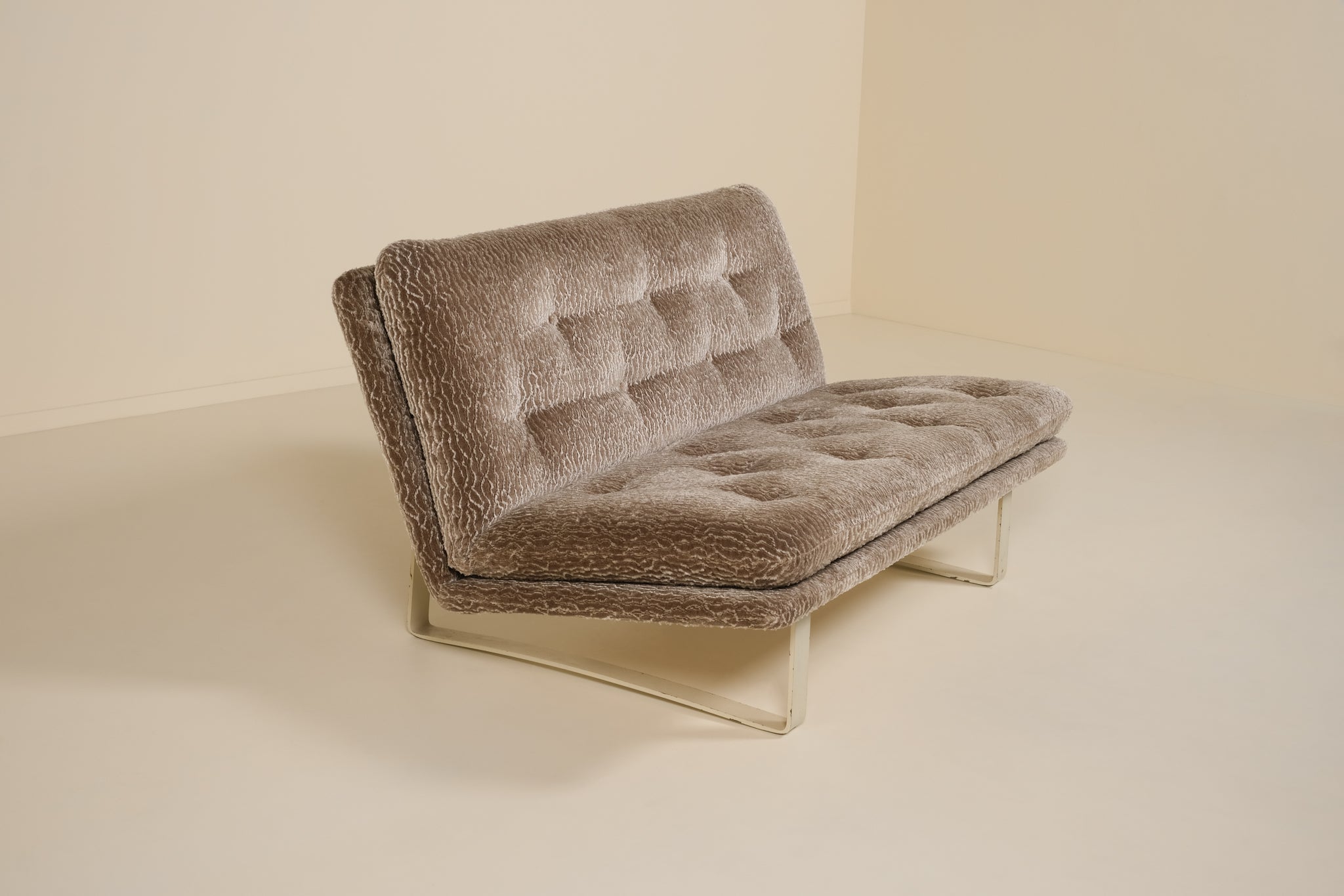 Brown textured sofa on a beige background