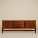 Wooden sideboard with a minimalist design on a beige background