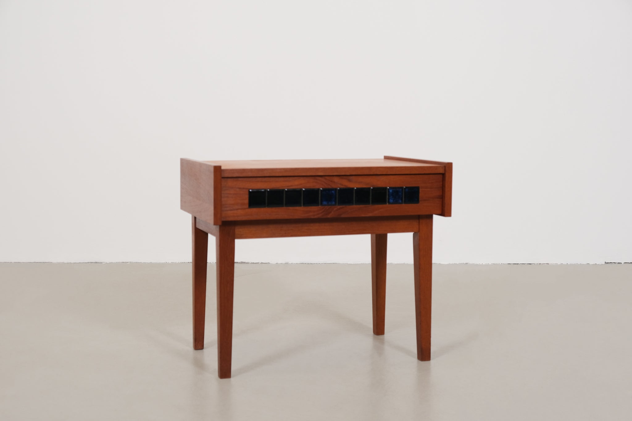 Cabinet with small blue tiles