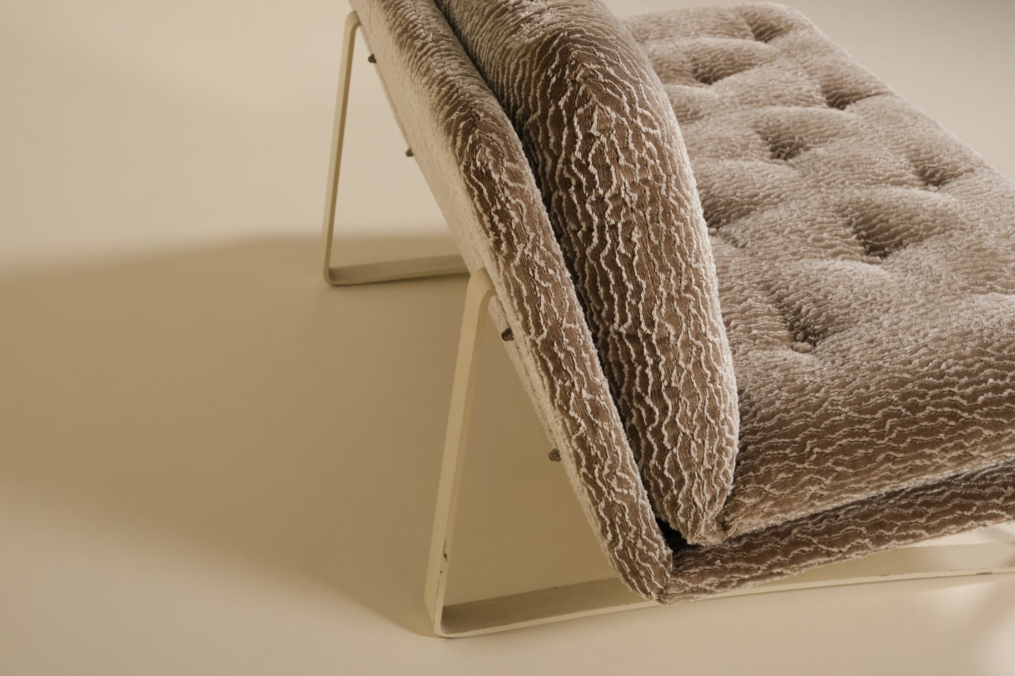 Brown textured artifort sofa on a beige background