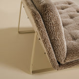 Brown textured artifort sofa on a beige background