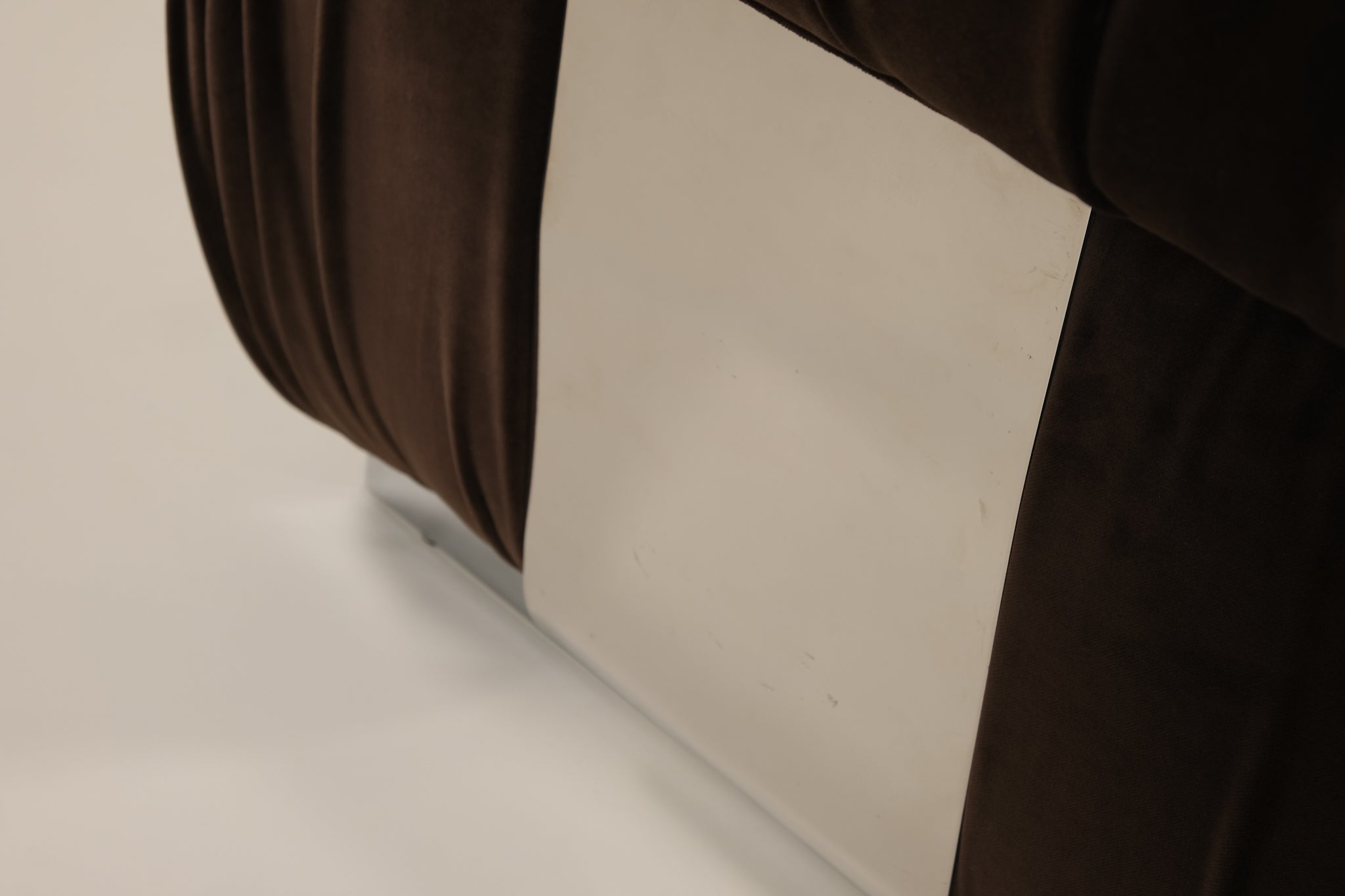 Close-up of a chair on a beige surface
