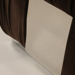 Close-up of a chair on a beige surface