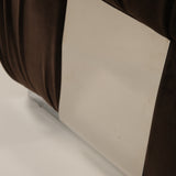 Close-up of a chair on a beige surface