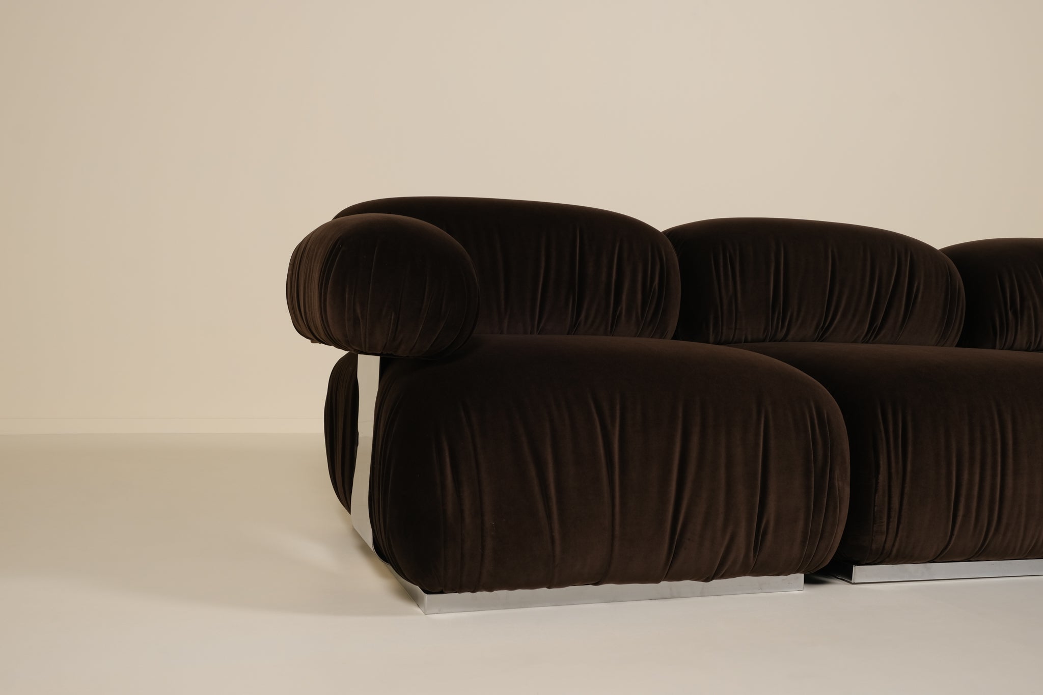 Brown sofa with a ribbed texture on a beige background