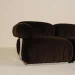 Brown sofa with a ribbed texture on a beige background