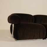 Brown sofa with a ribbed texture on a beige background