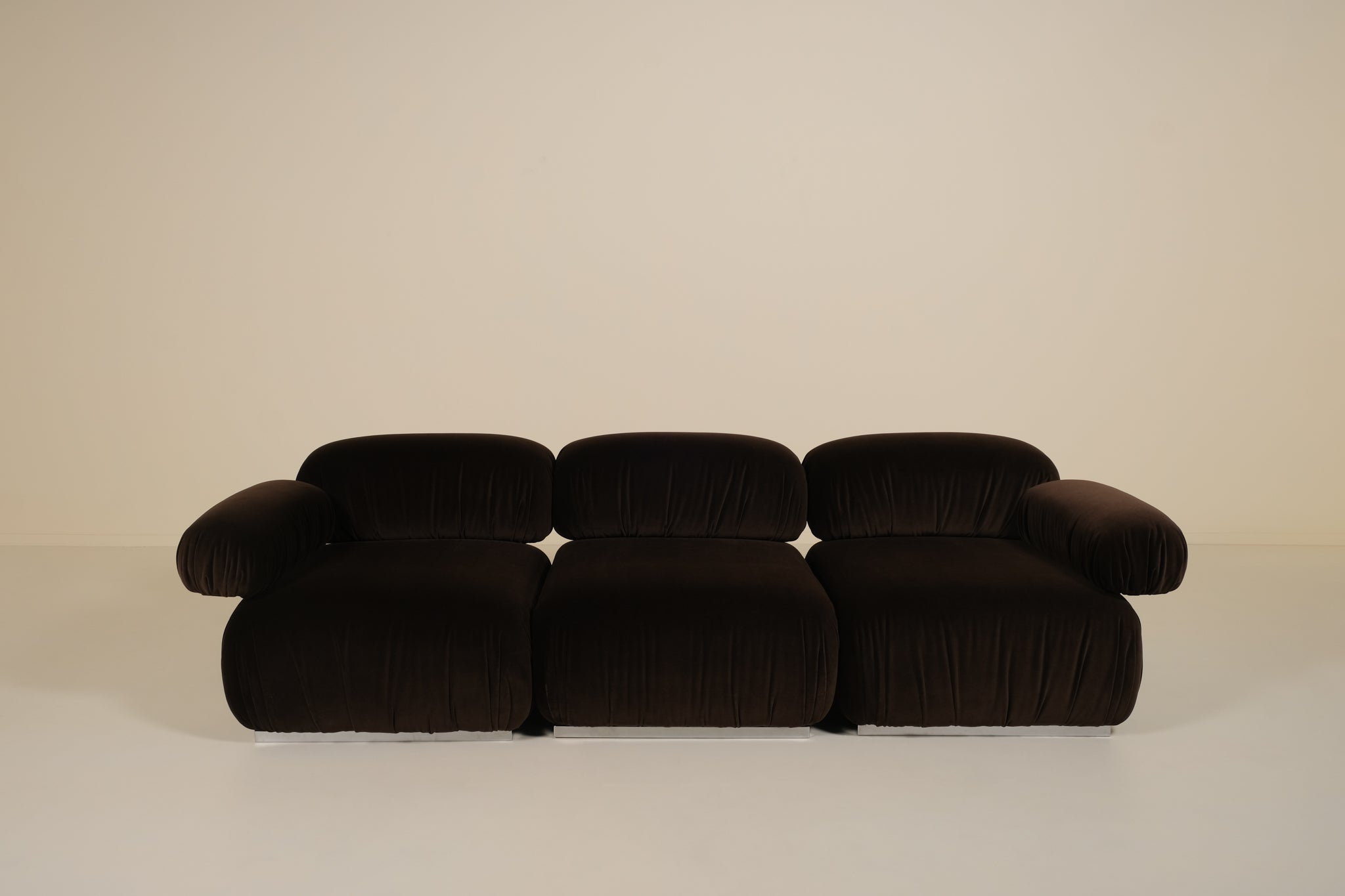 Dark brown sofa on a beige background
