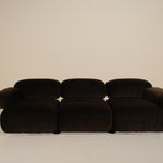 Dark brown sofa on a beige background