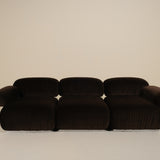 Dark brown sofa on a beige background