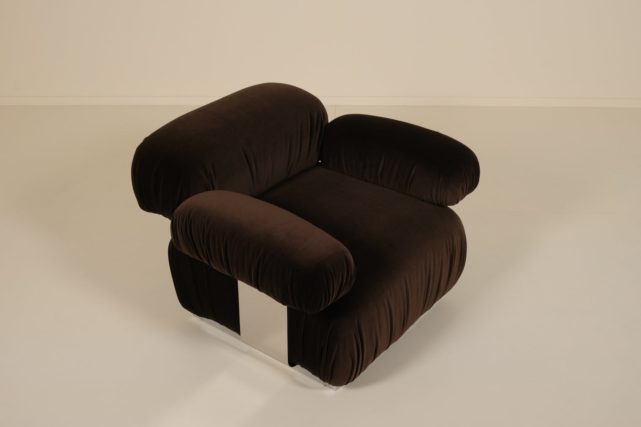 Brown armchair on a beige background