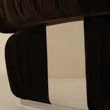 Close-up of a dark brown upholstered chair with a beige background
