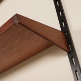 Wooden shelf bracket attached to a wall with a metal bracket.