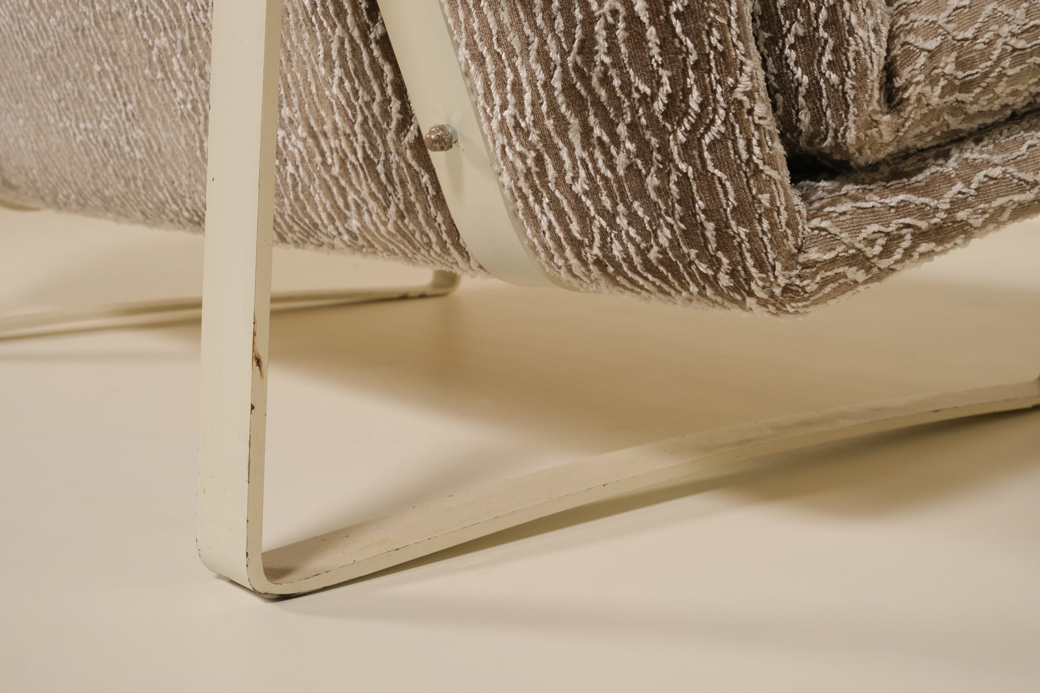 Close-up of a artifort sofa on a beige surface