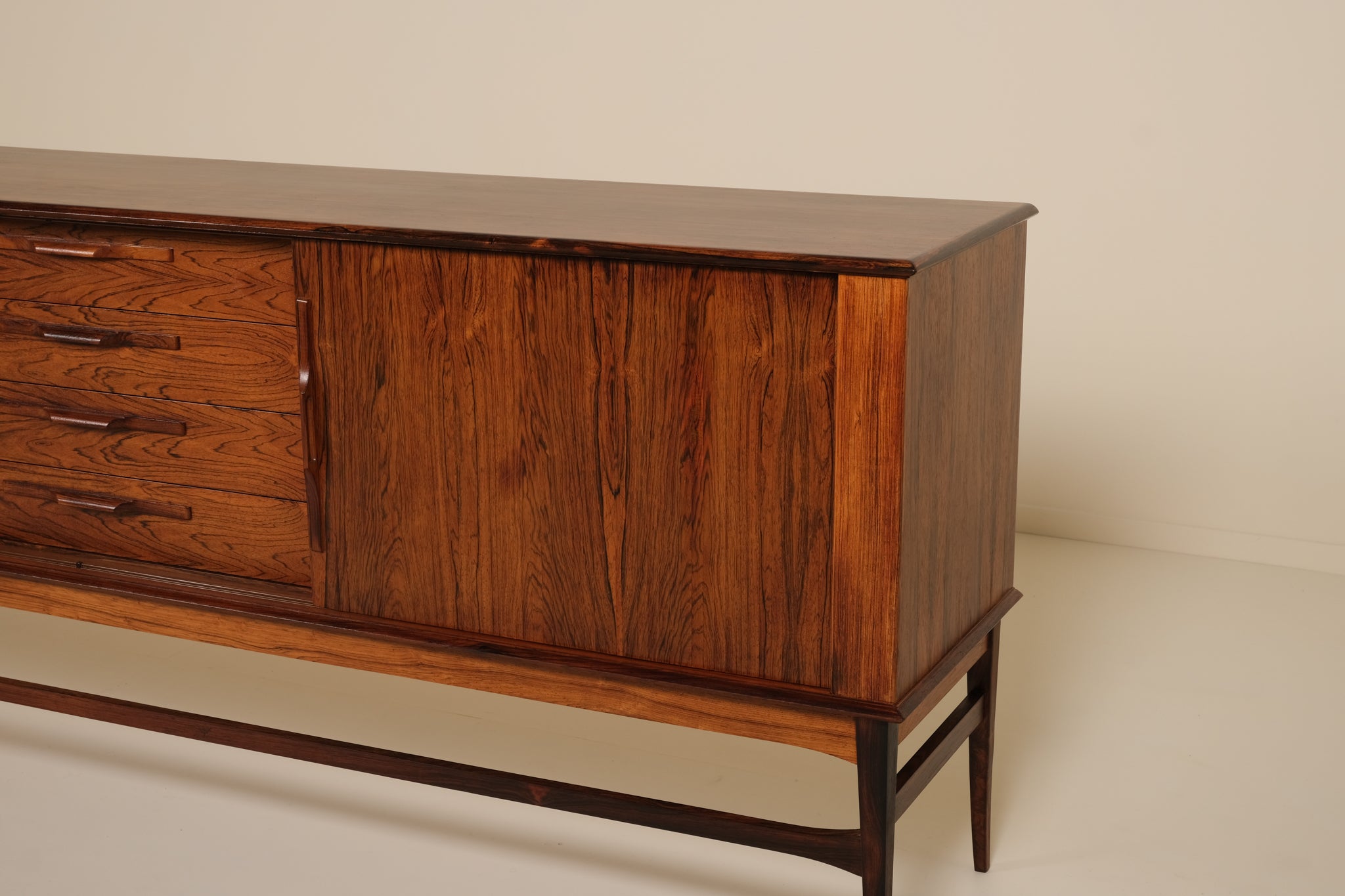 Wooden sideboard with drawers on a plain background