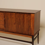 Wooden sideboard with drawers on a plain background