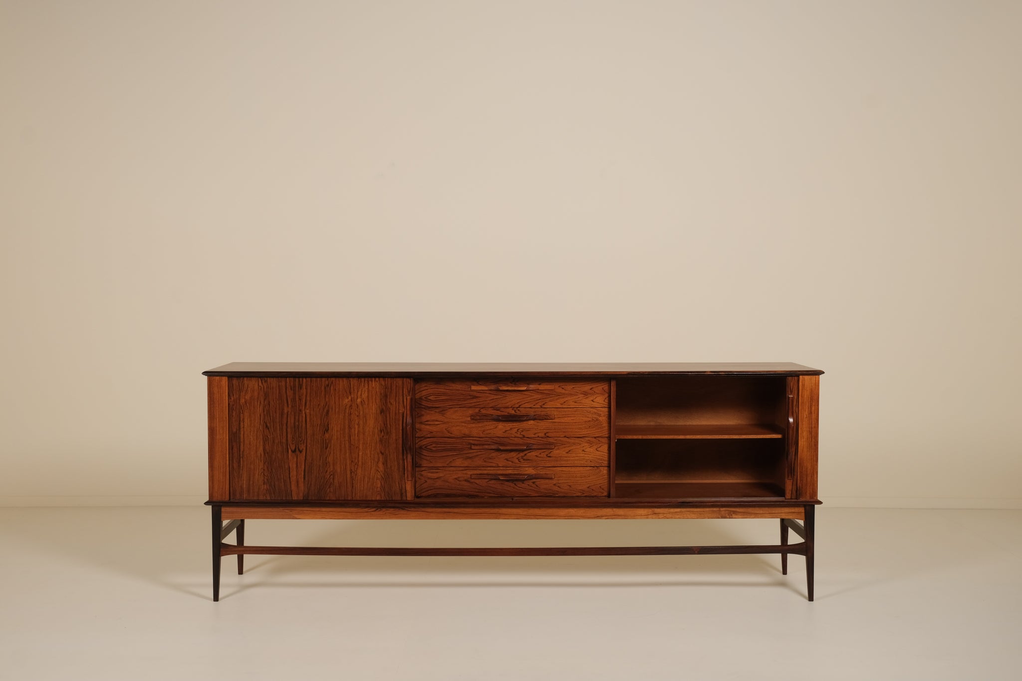 Wooden rosewood sideboard against a beige background