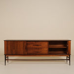 Wooden rosewood sideboard against a beige background
