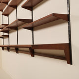Wooden shelves on a wall with a neutral background