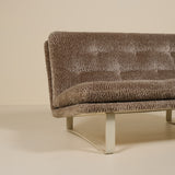 Brown textured sofa on a beige background