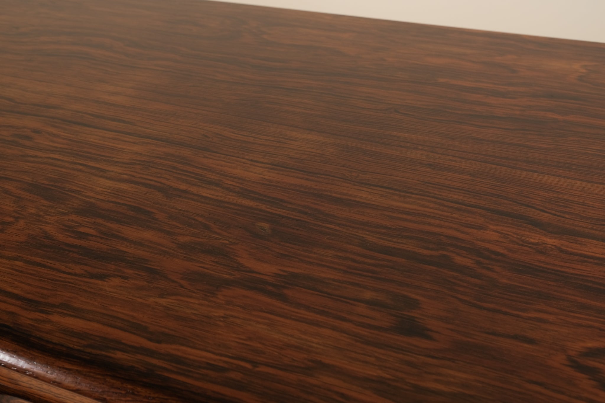 Close-up of a wooden surface with visible grain and texture.