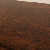Close-up of a wooden surface with visible grain and texture.
