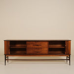 Wooden rosewood sideboard with open shelves on a beige background