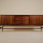 Wooden sideboard with drawers on a beige background
