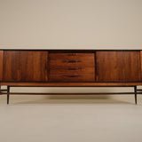 Wooden sideboard with drawers on a beige background