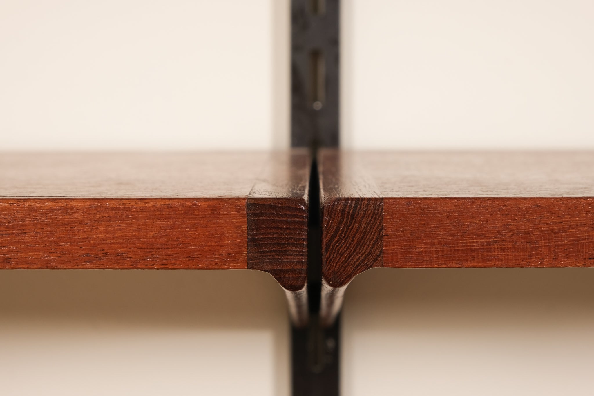 Close-up of a wooden shelves with a beige background